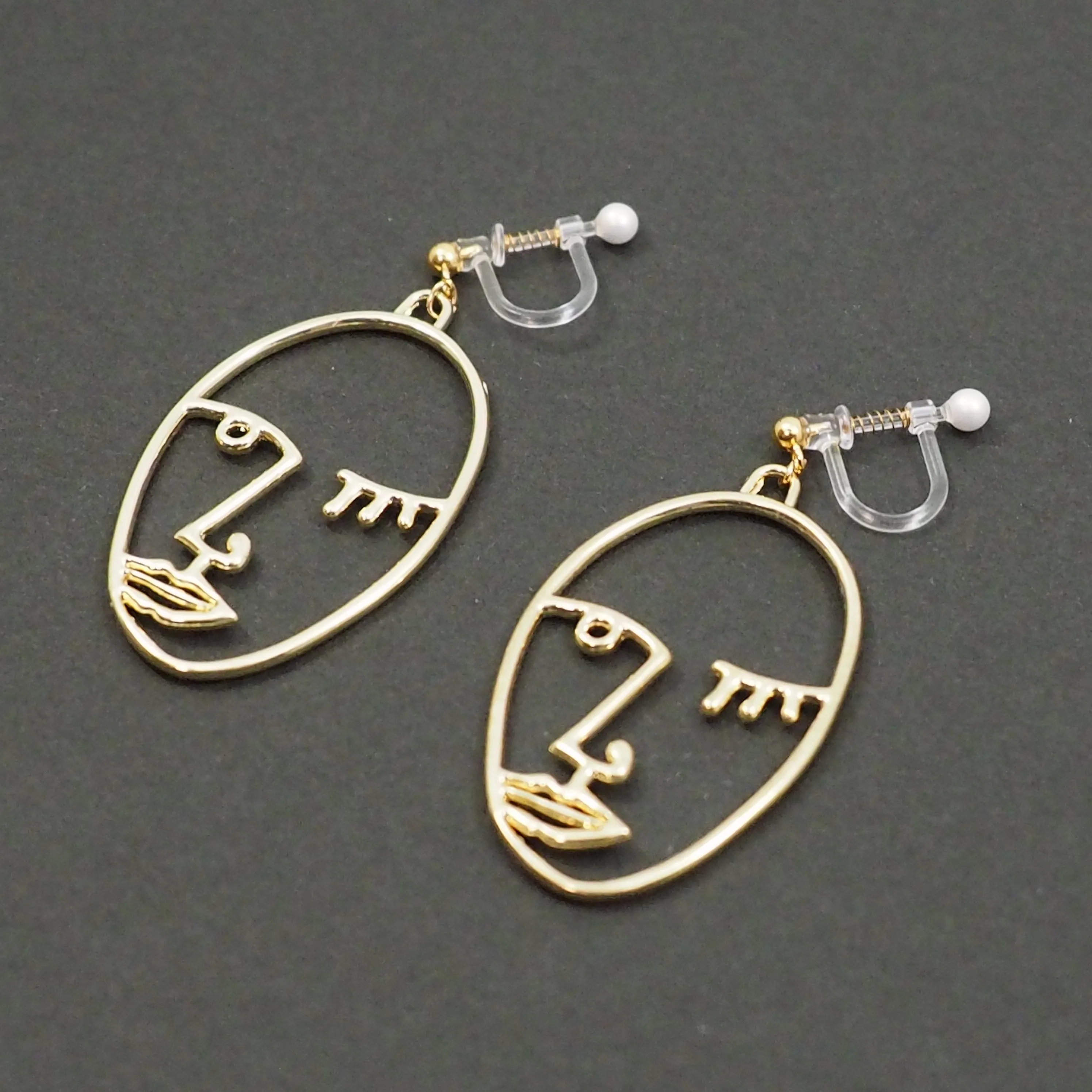 Gold Picasso Face Wink Invisible Clip On Earrings