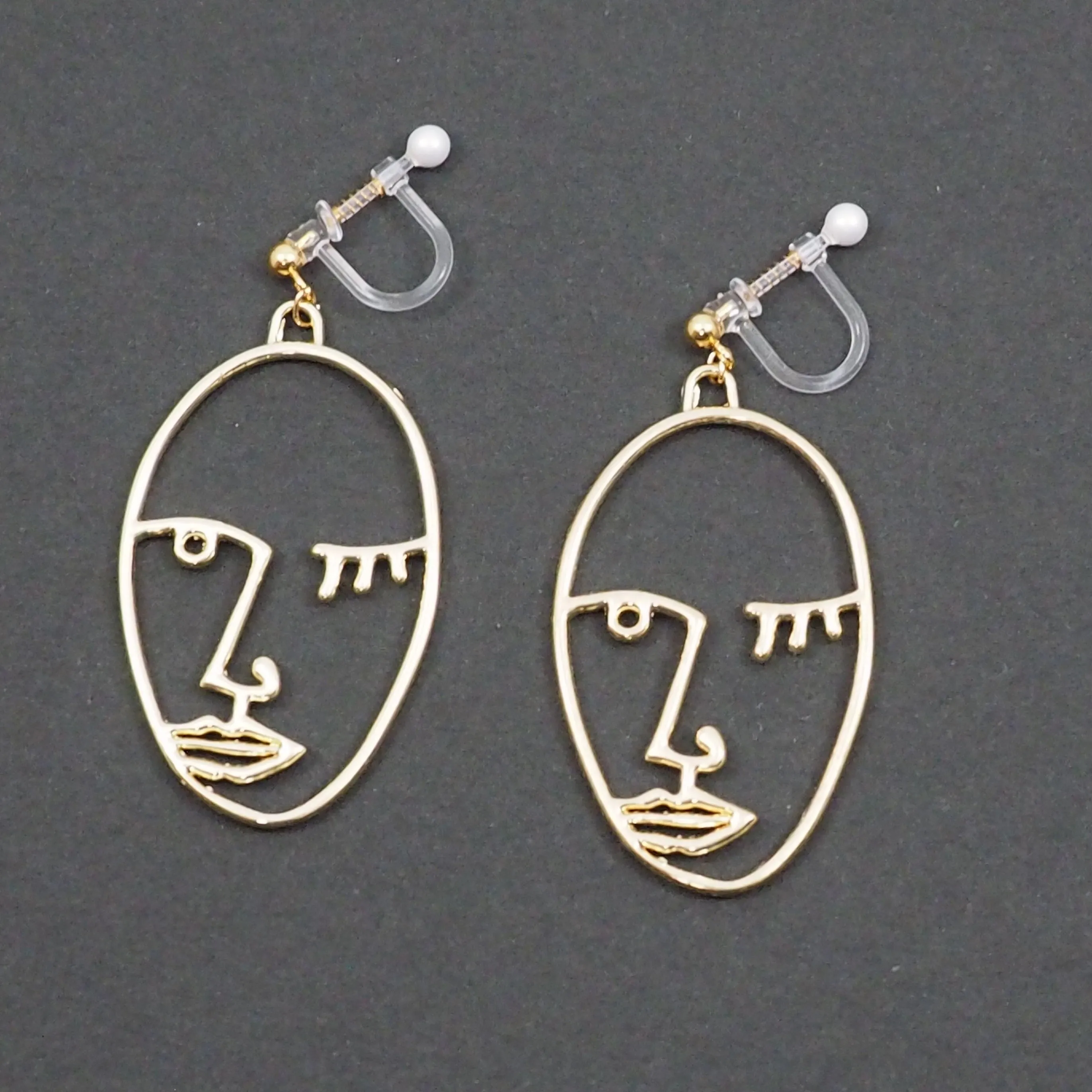 Gold Picasso Face Wink Invisible Clip On Earrings