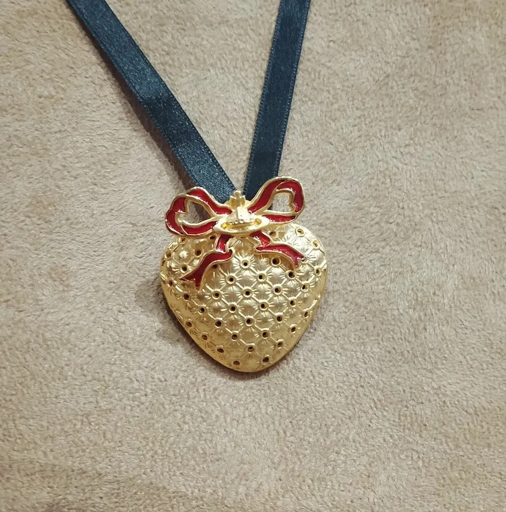 Vivienne Westwood Golden Heart brooch pendant with Red Bow